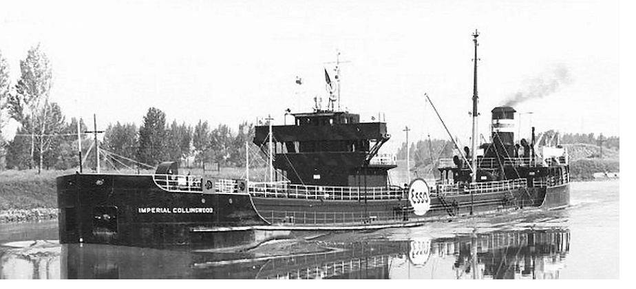 A black-hulled tanker, Imperial Collingwood, broadside in calm water.