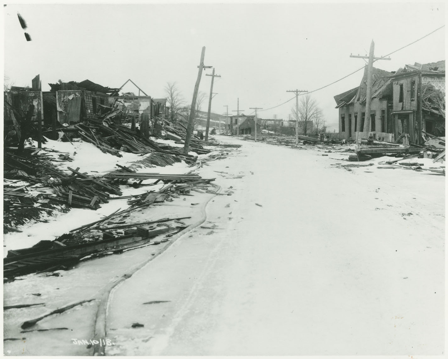 Snow-covered Campbell Road in Halifax with houses damaged by the 1917 explosion
