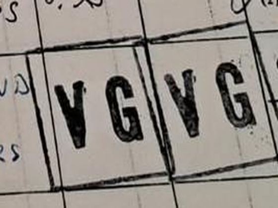 A black rubber stamp reading V G and V G in two ruled boxes.