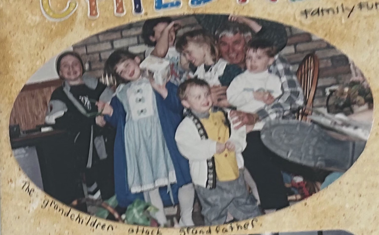 Robert Davies surrounded by grandchildren in Halloween costumes at Allandale