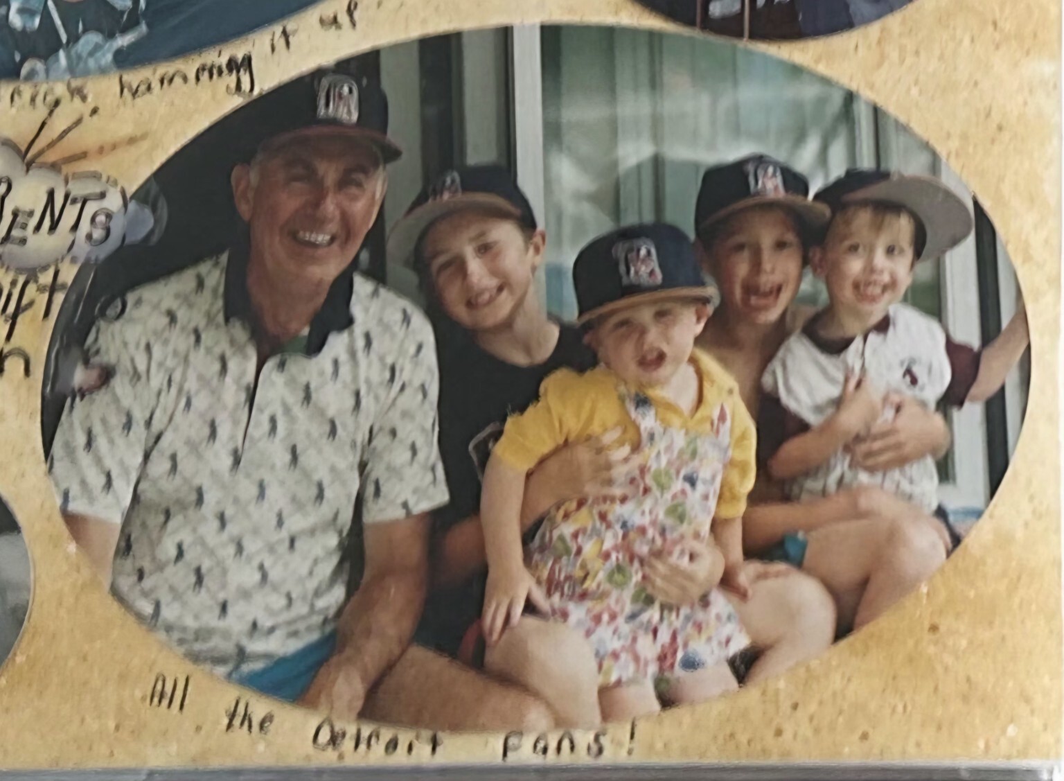 Robert Davies with five grandsons wearing matching Detroit Tigers caps