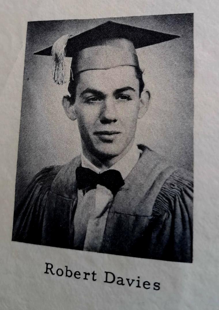 A yearbook graduation portrait: young man in cap and gown with bow tie, captioned Robert Davies.
