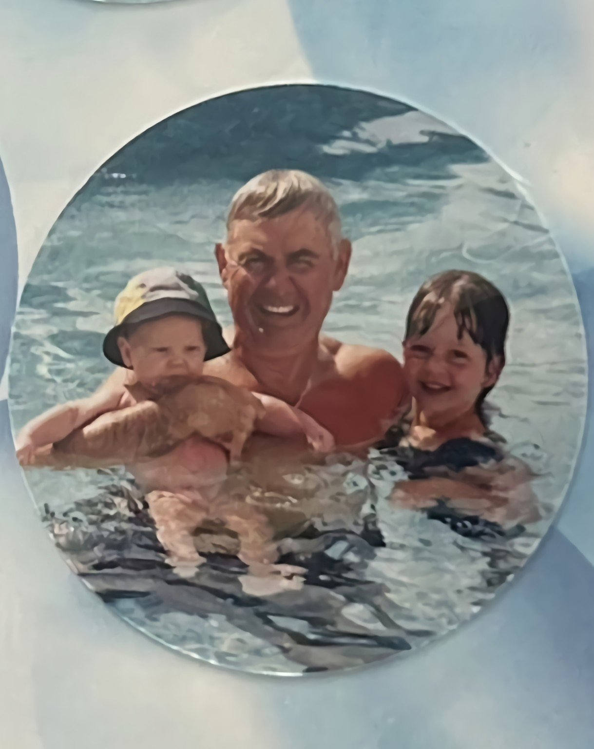 Robert Davies in the pool with grandchildren