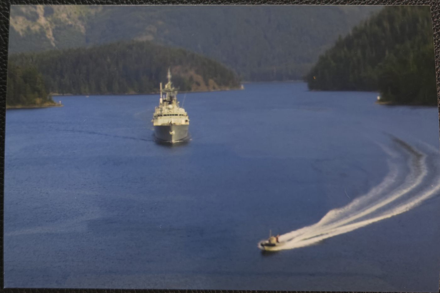 HMCS Calgary and RHIB deployed from the air by the embedeed Sea King and flight crew on a sov pat