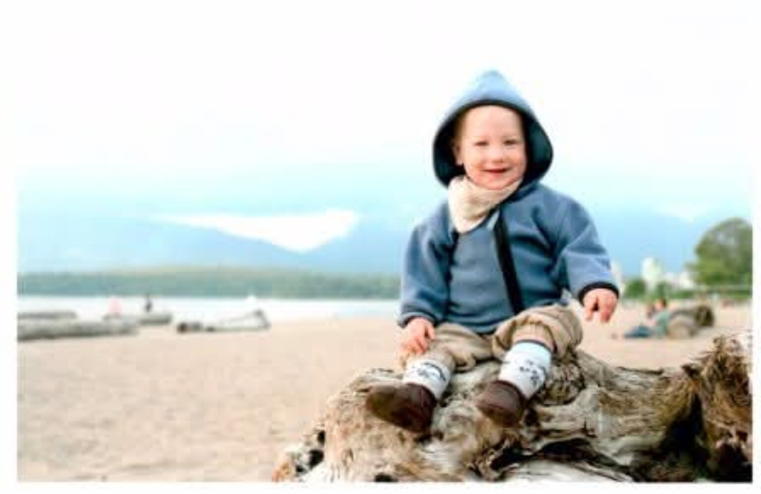 One-year-old Jonte sitting on driftwood at Spanish Banks in Vancouver in 2010